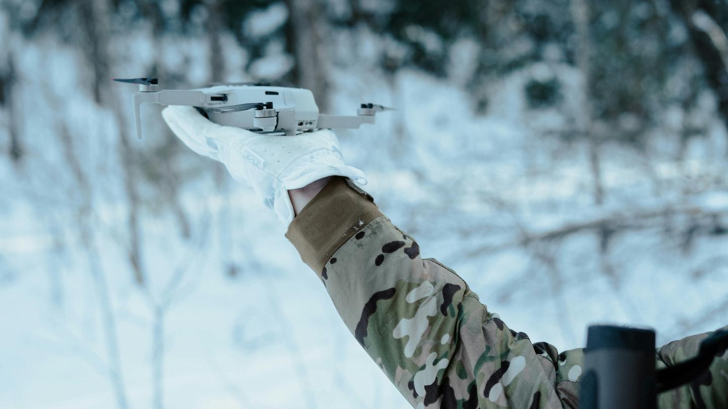 Militia member holds commercial DJI drone for take off. Credit: unsplash