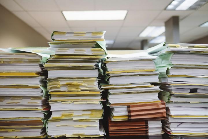 Paperwork. Photo: Wesley Tingy/Unsplash.