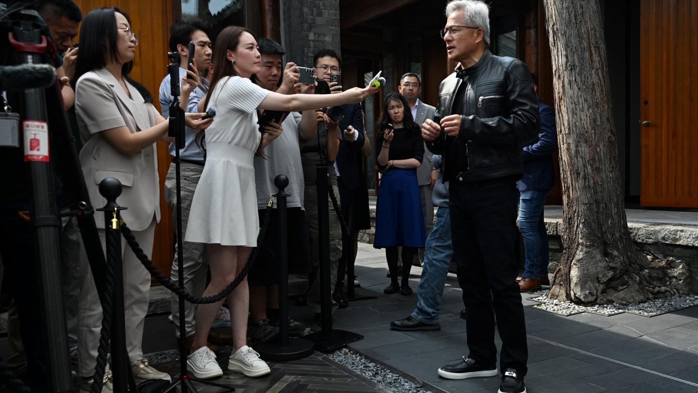 Nvidia CEO Jensen Huang speaks to journalists as he arrives for a press conference at a hotel in Beijing on July 16, 2025. Photo: Adek BERRY / AFP
