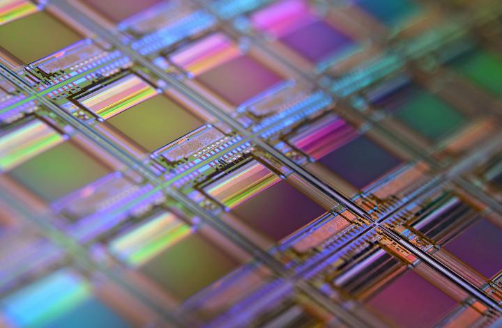 A silicon wafer with microchips including microscopic transistors and circuits. Photo: by Laura Ockel on Unsplash.