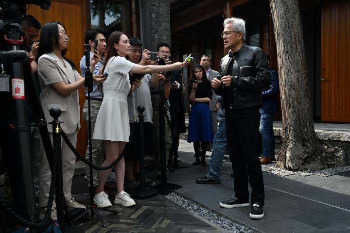 Nvidia CEO Jensen Huang speaks to journalists as he arrives for a press conference at a hotel in Beijing on July 16, 2025. Photo: Adek BERRY / AFP