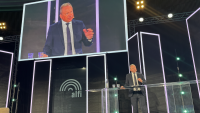 Luxembourg&#039;s Finance Minister Gilles Roth speaking at a conference earlier this year. Photo: IO.