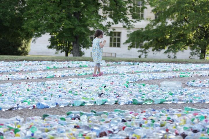 A Child Explores &#039;Recycling Labyrinth&#039; Art Installation at U.N. Office Geneva, by United States Mission Geneva, CC BY-ND 2.0