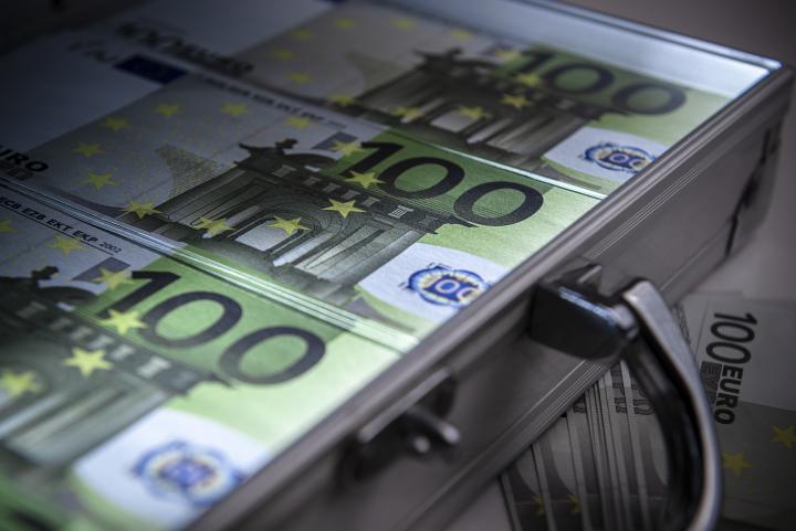 Euro notes in a suitcase. Photo: iStock.