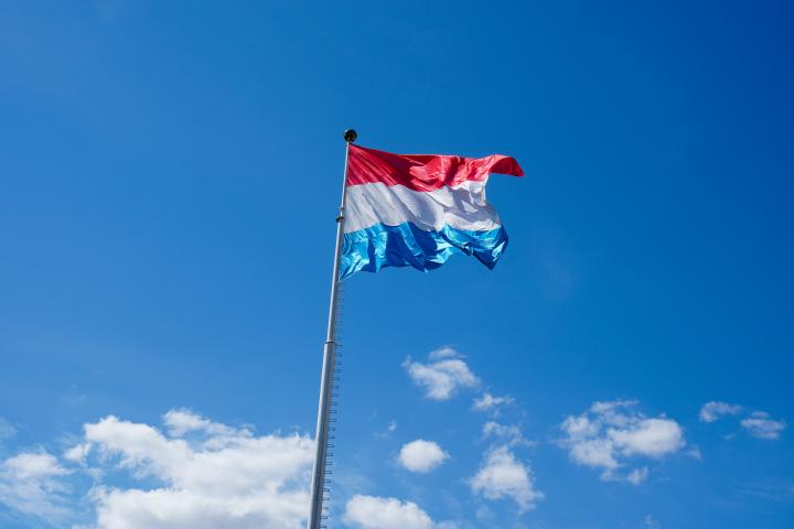 Luxembourg flag against blue sky